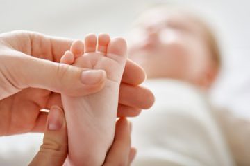 doctor examining a baby